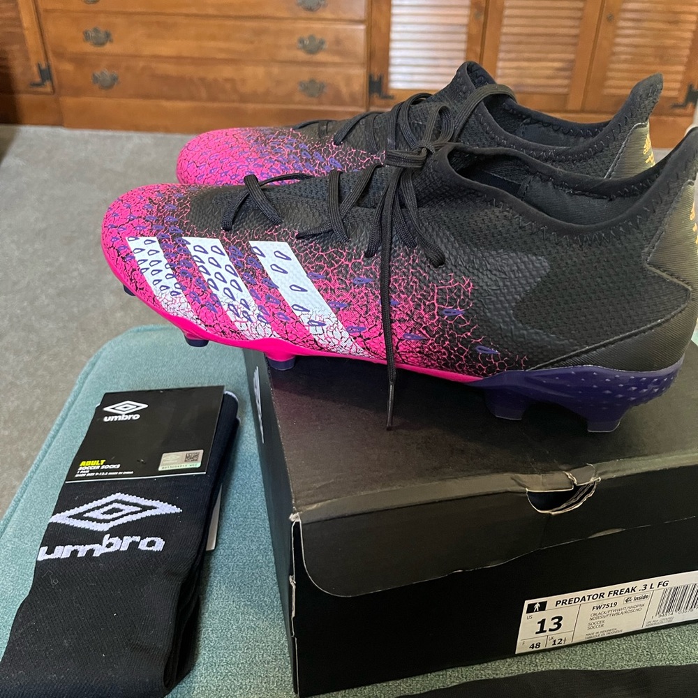 4 pcs Soccer Set!! Brand new cleats, 2 pairs of socks & 1 pair of shin guards.